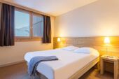 Double bedroom at Les Gemeaux P&V La Plagne