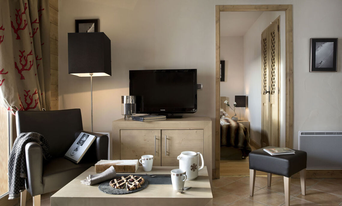 Apartment living space with bedroom to the side