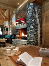 An example of reading by the fire in L'Oree des Neiges, Vallandry, France