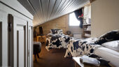 Twin bedroom with stylish modern covers in 6 person fireplace apartment Residence Village Montana Val Thorens