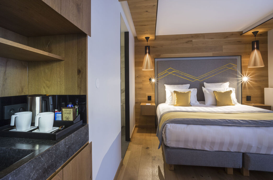 Alparena Junior Suite bedroom and kitchenette