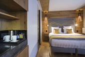 Alparena Junior Suite bedroom and kitchenette