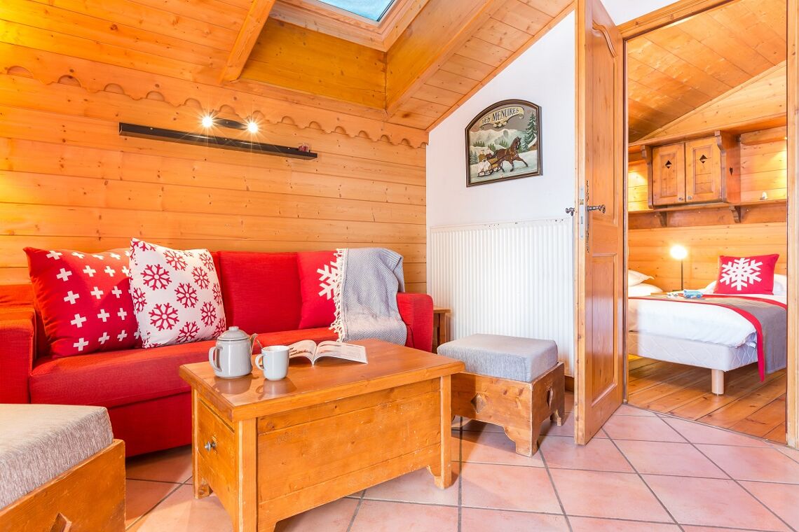 Bedroom opening off living room kitchen sunny apartment Les Alpages de Reberty Les Menuires