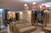 Les Balcons Platinum Val Thorens large lounge area in apartment