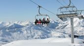 Skiers on a chairlift in Chatel