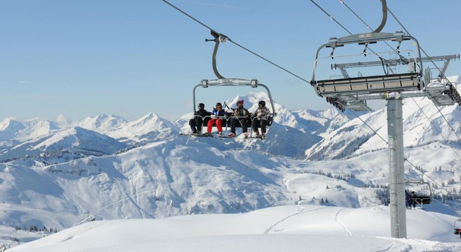Skiers on a chairlift in Chatel